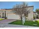 Charming single-story home with a well-maintained lawn, two-car garage and desert landscaping at 8243 E Cortez Dr, Scottsdale, AZ 85260