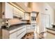 Well-equipped kitchen with white cabinets, black counters, and an efficient layout at 8243 E Cortez Dr, Scottsdale, AZ 85260