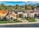 Scenic aerial view of home with solar panels, manicured lawns, landscaping and neighborhood at 8334 E Jenan Dr, Scottsdale, AZ 85260