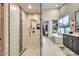 Modern bathroom with a glass-enclosed shower featuring decorative tile accents, plus a soaking tub at 8334 E Jenan Dr, Scottsdale, AZ 85260