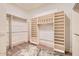 Spacious walk-in closet with built-in shelving and hanging rods for ample storage at 8334 E Jenan Dr, Scottsdale, AZ 85260