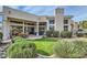 Beautiful backyard view of the home featuring a well-maintained yard with manicured landscaping at 8334 E Jenan Dr, Scottsdale, AZ 85260