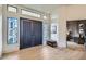 Inviting foyer with wood flooring, decorative windows, and high ceilings at 8334 E Jenan Dr, Scottsdale, AZ 85260