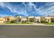 Stunning single-story house with a desert landscape, lush green lawn, and a welcoming front entrance at 8334 E Jenan Dr, Scottsdale, AZ 85260