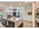 Modern kitchen island features a marble countertop and sleek cabinetry, open to the living space at 8334 E Jenan Dr, Scottsdale, AZ 85260