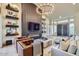 Stylish living room with a statement fireplace, modern shelving, and comfortable seating at 8334 E Jenan Dr, Scottsdale, AZ 85260