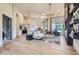 Spacious living room with hardwood floors, modern lighting, and open floor plan at 8334 E Jenan Dr, Scottsdale, AZ 85260