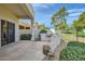 An outdoor kitchen with built-in grill in a covered patio provides seamless indoor-outdoor living at 8334 E Jenan Dr, Scottsdale, AZ 85260