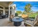 Inviting covered patio area with stylish seating and a cozy fire pit, perfect for outdoor gatherings at 8334 E Jenan Dr, Scottsdale, AZ 85260