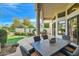 Inviting outdoor patio with a dining table, seating area, and lush landscaping at 8334 E Jenan Dr, Scottsdale, AZ 85260