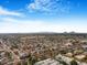 Aerial view of community featuring surrounding mountain views and numerous homes at 8626 E Mackenzie Dr, Scottsdale, AZ 85251