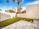 Small backyard with artificial turf and potted plants at 8626 E Mackenzie Dr, Scottsdale, AZ 85251