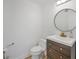 Stylish half bathroom with modern vanity and round mirror at 8626 E Mackenzie Dr, Scottsdale, AZ 85251