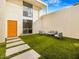 Private courtyard with artificial turf and modern seating at 8626 E Mackenzie Dr, Scottsdale, AZ 85251