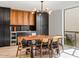 Mid-century modern dining area with long wood table at 8626 E Mackenzie Dr, Scottsdale, AZ 85251