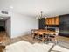 Mid-century modern dining area with long wood table at 8626 E Mackenzie Dr, Scottsdale, AZ 85251