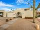 Mid-century modern home with a landscaped front yard and gated entry at 8626 E Mackenzie Dr, Scottsdale, AZ 85251