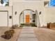 Modern arched gate entrance to a mid-century home at 8626 E Mackenzie Dr, Scottsdale, AZ 85251