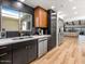 Modern kitchen with stainless steel appliances and two-toned cabinetry at 8626 E Mackenzie Dr, Scottsdale, AZ 85251