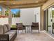 Covered patio with seating area and tile flooring at 8626 E Mackenzie Dr, Scottsdale, AZ 85251