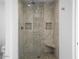 Large walk-in shower with mosaic tile and built-in seat at 8626 E Mackenzie Dr, Scottsdale, AZ 85251