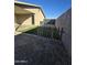 Small backyard with artificial turf and wooden fence at 8651 W Glenrosa Ave, Phoenix, AZ 85037