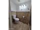 Simple bathroom with toilet and tile flooring at 8651 W Glenrosa Ave, Phoenix, AZ 85037