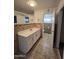 Main bathroom with double vanity and tile flooring at 8651 W Glenrosa Ave, Phoenix, AZ 85037