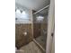 Clean bathroom with shower stall and tile flooring at 8651 W Glenrosa Ave, Phoenix, AZ 85037