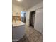 Bathroom with vanity, walk-in closet and tile floor at 8651 W Glenrosa Ave, Phoenix, AZ 85037