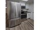 Modern kitchen, stainless steel appliances and granite countertops at 8651 W Glenrosa Ave, Phoenix, AZ 85037