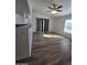 Living room with sliding glass doors and wood-look floors at 8651 W Glenrosa Ave, Phoenix, AZ 85037