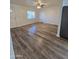 Bright living room featuring wood-look floors at 8651 W Glenrosa Ave, Phoenix, AZ 85037