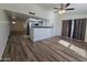 Bright living room with laminate flooring and kitchen view at 8651 W Glenrosa Ave, Phoenix, AZ 85037