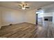 Spacious living room with wood-look floors and fireplace at 8651 W Glenrosa Ave, Phoenix, AZ 85037