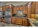 Kitchen boasts stainless steel appliances and granite countertops at 9135 E Buckskin Trl, Scottsdale, AZ 85255