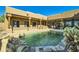 Expansive pool area with flagstone decking and desert landscaping at 9135 E Buckskin Trl, Scottsdale, AZ 85255