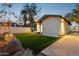 Artificial turf backyard with a patio and exterior lighting at 929 E Granada Rd, Phoenix, AZ 85006