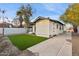 House exterior and grassy backyard with gravel at 929 E Granada Rd, Phoenix, AZ 85006