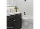 Modern bathroom with dark vanity and bathtub at 929 E Granada Rd, Phoenix, AZ 85006