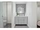 Modern bathroom with gray vanity, hexagon tile, and glass shower at 929 E Granada Rd, Phoenix, AZ 85006