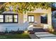 Inviting front porch with two adirondack chairs and landscape lighting at 929 E Granada Rd, Phoenix, AZ 85006