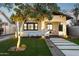 House exterior showcasing a classic bungalow style with a front porch and landscaping at 929 E Granada Rd, Phoenix, AZ 85006