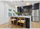 Modern kitchen with dark cabinetry and a breakfast bar at 929 E Granada Rd, Phoenix, AZ 85006