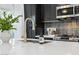 Close-up of kitchen sink with gold faucet and white countertop at 929 E Granada Rd, Phoenix, AZ 85006