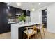 Contemporary kitchen with white countertops and dark cabinets at 929 E Granada Rd, Phoenix, AZ 85006