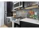 Modern kitchen with stainless steel appliances and white countertops at 929 E Granada Rd, Phoenix, AZ 85006