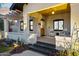 Bright front porch with two chairs and a wooden ceiling at 929 E Granada Rd, Phoenix, AZ 85006