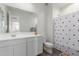 Modern bathroom with white vanity, toilet, and polka dot shower curtain at 9354 E Sector Dr, Mesa, AZ 85212