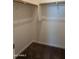 Spacious walk-in closet with wood shelving at 9447 W Glenrosa Ave, Phoenix, AZ 85037